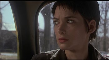 Movie still from “Girl, Interrupted” (1999), directed by James Mangold – A person in a car looking out a window; Close Up shot, Over the shoulder angle