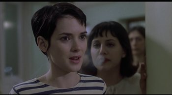 Movie still from “Girl, Interrupted” (1999), directed by James Mangold – A woman standing next to another woman in a room; Close Up shot, Over the shoulder angle