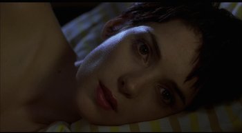 Movie still from “Girl, Interrupted” (1999), directed by James Mangold – A person laying in a bed; Close Up shot, High angle