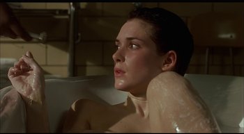 Movie still from “Girl, Interrupted” (1999), directed by James Mangold – A woman sitting in a bath tub in a bathroom; Close Up shot, High angle
