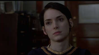 Movie still from “Girl, Interrupted” (1999), directed by James Mangold – A person with short black hair; Close Up shot, Over the shoulder angle