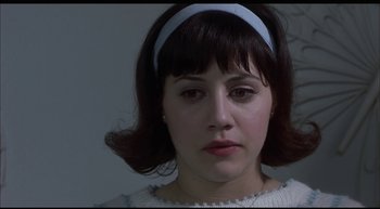 Movie still from “Girl, Interrupted” (1999), directed by James Mangold – A person wearing a headband; Close Up shot, High angle