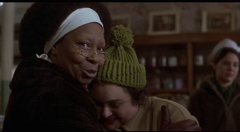 Movie still from “Girl, Interrupted” (1999), directed by James Mangold – Two people sitting on a couch with one of them wearing a green hat; Close Up shot, Over the shoulder angle