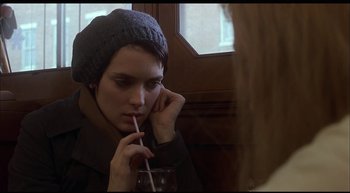 Movie still from “Girl, Interrupted” (1999), directed by James Mangold – A woman holding a straw and drinking a drink; Close Up shot, Over the shoulder angle