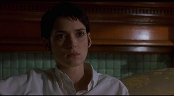 Movie still from “Girl, Interrupted” (1999), directed by James Mangold – A woman with short hair wearing a white shirt; Close Up shot, Low angle