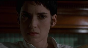 Movie still from “Girl, Interrupted” (1999), directed by James Mangold – A person with short black hair; Close Up shot, Low angle