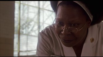 Movie still from “Girl, Interrupted” (1999), directed by James Mangold – An older woman wearing glasses looking at the camera; Close Up shot, Low angle