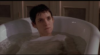 Movie still from “Girl, Interrupted” (1999), directed by James Mangold – A woman sitting in a tub of water looking at the camera; Close Up shot, High angle