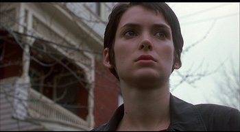 Movie still from “Girl, Interrupted” (1999), directed by James Mangold – A person with short black hair; Close Up shot, Low angle