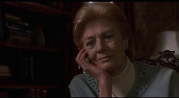 Movie still from “Girl, Interrupted” (1999), directed by James Mangold – An older woman sitting in front of a book shelf; Close Up shot, Low angle