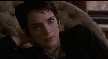 Movie still from “Girl, Interrupted” (1999), directed by James Mangold – A person laying on a couch; Close Up shot, High angle