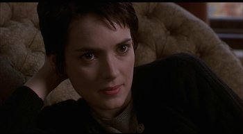 Movie still from “Girl, Interrupted” (1999), directed by James Mangold – A person sitting on a couch; Close Up shot, High angle