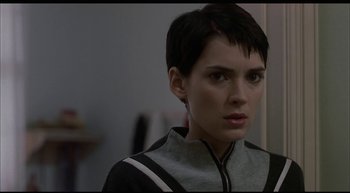 Movie still from “Girl, Interrupted” (1999), directed by James Mangold – A person with short black hair; Close Up shot, Over the shoulder angle