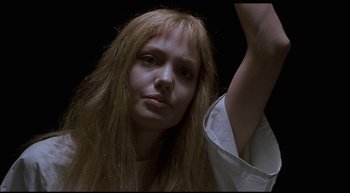 Movie still from “Girl, Interrupted” (1999), directed by James Mangold – A person with long hair; Close Up shot, Low angle