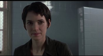 Movie still from “Girl, Interrupted” (1999), directed by James Mangold – A person with short black hair; Close Up shot, Over the shoulder angle