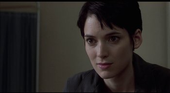 Movie still from “Girl, Interrupted” (1999), directed by James Mangold – A person with short black hair; Close Up shot, Over the shoulder angle