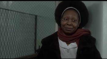 Movie still from “Girl, Interrupted” (1999), directed by James Mangold – An older woman wearing glasses and a head scarf; Close Up shot, Over the shoulder angle