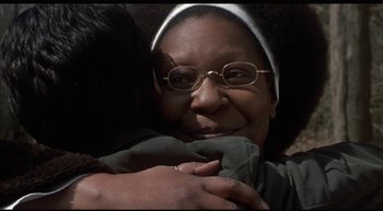 Movie still from “Girl, Interrupted” (1999), directed by James Mangold – An older woman is hugging a younger woman; Close Up shot, Over the shoulder angle