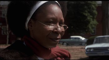 Movie still from “Girl, Interrupted” (1999), directed by James Mangold – An older woman wearing glasses and a red scarf; Close Up shot, Over the shoulder angle