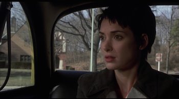 Movie still from “Girl, Interrupted” (1999), directed by James Mangold – A woman sitting in the back of a car looking out the window; Close Up shot, Over the shoulder angle