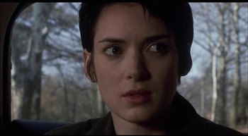 Movie still from “Girl, Interrupted” (1999), directed by James Mangold – A person with short black hair; Close Up shot, Over the shoulder angle