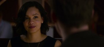 Movie still from “Black Mirror” (2011), created by Charlie Brooker – A person wearing a black shirt; Close Up shot, Over the shoulder angle