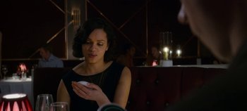 Movie still from “Black Mirror” (2011), created by Charlie Brooker – A woman holding a cell phone in her hands; Close Up shot, Over the shoulder angle