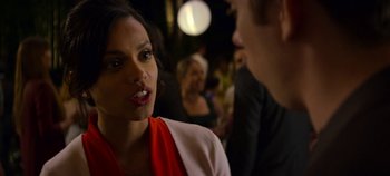 Movie still from “Black Mirror” (2011), created by Charlie Brooker – A woman talking to a man at a party; Close Up shot, Over the shoulder angle