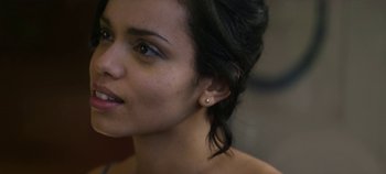 Movie still from “Black Mirror” (2011), created by Charlie Brooker – A woman's face with ear piercings; Close Up shot, Over the shoulder angle