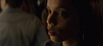 Movie still from “Black Mirror” (2011), created by Charlie Brooker – A person with a nose ring; Close Up shot, High angle