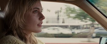 Movie still from “Greenberg” (2010), directed by Noah Baumbach – A woman looking out of the window of a car; Close Up shot, Over the shoulder angle