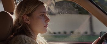 Movie still from “Greenberg” (2010), directed by Noah Baumbach – A woman sitting in a car looking out the window; Close Up shot, Over the shoulder angle
