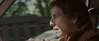 Movie still from “Greenberg” (2010), directed by Noah Baumbach – A person looking up at something; Close Up shot, Over the shoulder angle