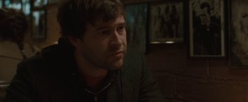 Movie still from “Greenberg” (2010), directed by Noah Baumbach – A person sitting in a room; Close Up shot, Over the shoulder angle