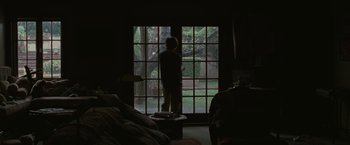Movie still from “Greenberg” (2010), directed by Noah Baumbach – A person standing in front of an open window; Wide shot, Low angle