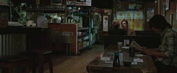 Movie still from “Greenberg” (2010), directed by Noah Baumbach – Two people sitting at a table in a restaurant; Wide shot, Over the shoulder angle