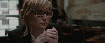 Movie still from “Greenberg” (2010), directed by Noah Baumbach – A woman wearing glasses and holding a cell phone; Close Up shot, Over the shoulder angle