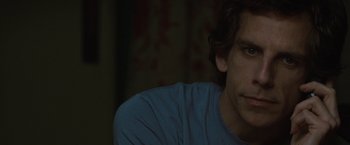Movie still from “Greenberg” (2010), directed by Noah Baumbach – A person wearing a blue t - shirt; Close Up shot, Over the shoulder angle