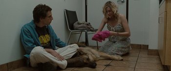 Movie still from “Greenberg” (2010), directed by Noah Baumbach – A man and a woman sitting on the floor next to a dog; Medium shot, High angle