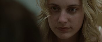 Movie still from “Greenberg” (2010), directed by Noah Baumbach – A woman's face with a sad look on her face; Close Up shot, Over the shoulder angle
