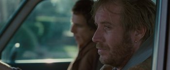 Movie still from “Greenberg” (2010), directed by Noah Baumbach – A man sitting next to another man in a car; Close Up shot, Over the shoulder angle