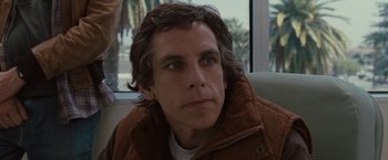 Movie still from “Greenberg” (2010), directed by Noah Baumbach – A person wearing a brown jacket; Close Up shot, Over the shoulder angle