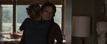 Movie still from “Greenberg” (2010), directed by Noah Baumbach – A man and a woman hugging in a room; Medium shot, Over the shoulder angle