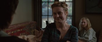 Movie still from “Greenberg” (2010), directed by Noah Baumbach – A woman sitting on a chair in a living room; Close Up shot, Over the shoulder angle