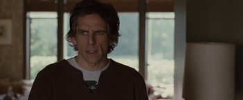 Movie still from “Greenberg” (2010), directed by Noah Baumbach – Ben stiller in a brown sweater in front of a window; Close Up shot, Over the shoulder angle