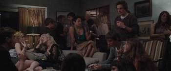 Movie still from “Greenberg” (2010), directed by Noah Baumbach – A group of people sitting around a room; Wide shot, Over the shoulder angle
