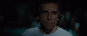 Movie still from “Greenberg” (2010), directed by Noah Baumbach – A person wearing a white t - shirt; Close Up shot, Over the shoulder angle