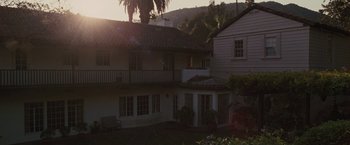 Movie still from “Greenberg” (2010), directed by Noah Baumbach – The sun is setting over a house in the mountains; Extreme Wide shot, High angle