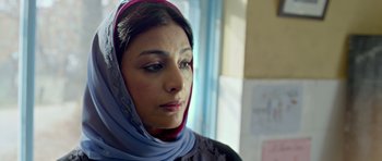 Movie still from “Haider” (2014), directed by Vishal Bhardwaj – A person wearing a headscarf; Close Up shot, Low angle