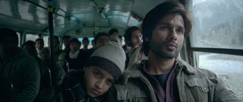 Movie still from “Haider” (2014), directed by Vishal Bhardwaj – A group of people sitting on a bus together; Close Up shot, Low angle
